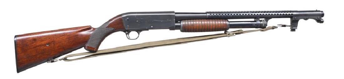 ITHACA MODEL 37 TRENCH PUMP SHOTGUN.: Cal. 12 Ga., 2 3/4". S# 57916. Bbl. 19 7/8". Receiver marked on left side "RLB" & flaming bomb. Bbl. marked on top left "ITHACA GUN CO INC MODEL - 37 12 GA - 2 3/4 CHAMBER". Marked on lower left bbl.