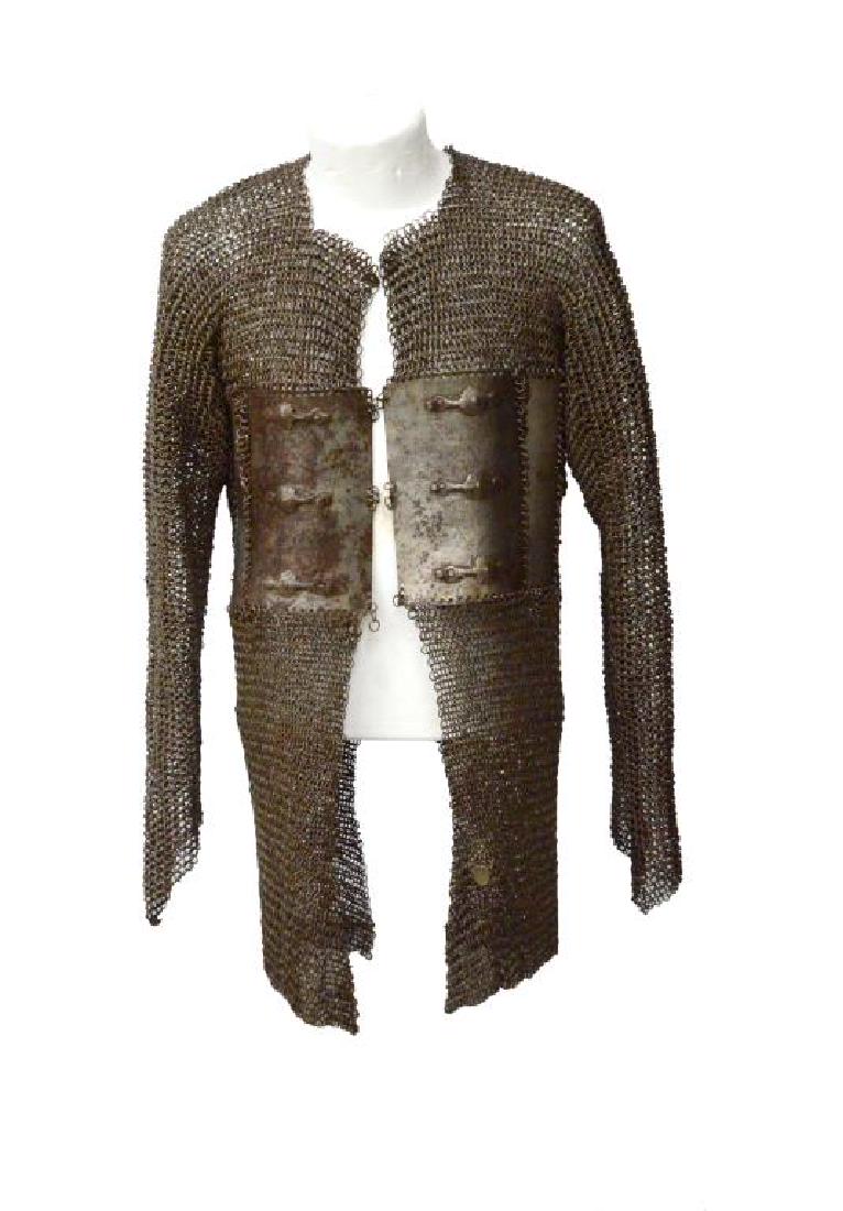 INDO-PERSIAN CHAIN MAIL ARMOR.: A classic example of Indo-Persian plate & mail armor of mid thigh length from the 18th or early 19th century. Front of shirt has 2 sm. plates & 2 lg. plates w/ 3 attachment hooks on each. Sleeves are 