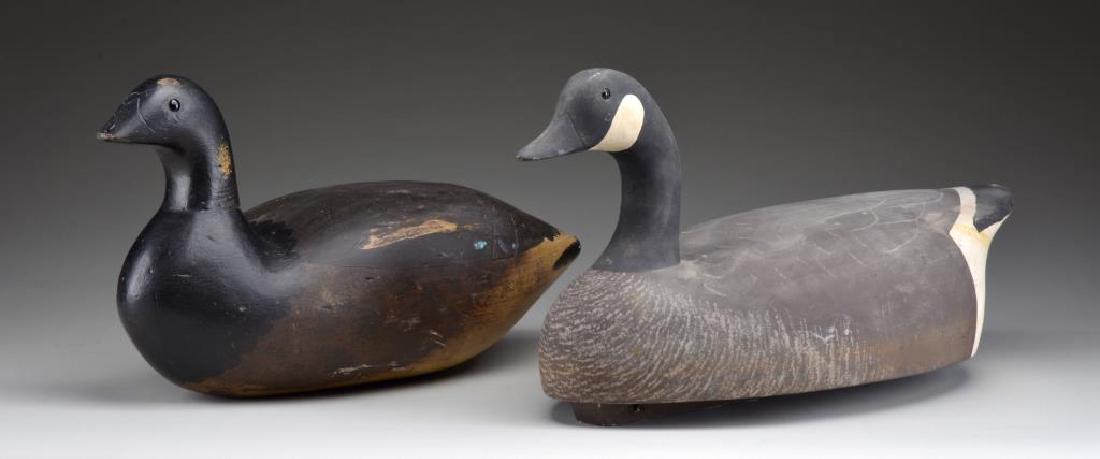 GROUP OF 2 WOODEN DECOYS.: One Canada goose. Has circular stamp on flat bottom "Point Pleasant Wildfowler Decoys Ct." Marked on wooden keel & bottom of decoy initials "J.R.I." Decoy painted in dull colors of Canada goose. Has g