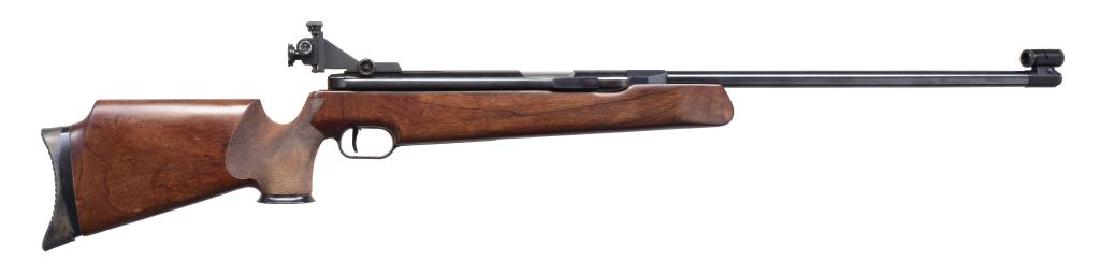 FEINWERKBAU MODEL 300 SIDE COCKING PELLET RIFLE.: Cal. .177 / 4.5mm Pellet. 460 FPS. S# 94791. Bbl. 22" fixed w/ rifling. Side cock single shot w/ sliding loading port cover & recoil compensation system. Globe front sight w/ aperture rear sight. Adj.
