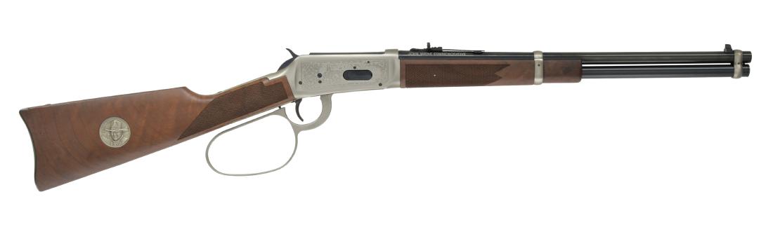 WINCHESTER 94 JOHN WAYNE CANADIAN ISSUE LEVER: ACTION CARBINE. Cal. 32-40 Win. S# CJW25. Bbl. 18" w/ sporting sights. Bbl. bands & lg. lever loop action w/ saddle ring are pewter plated. Ornamentation consists of John Wayne & cattle drive scene on