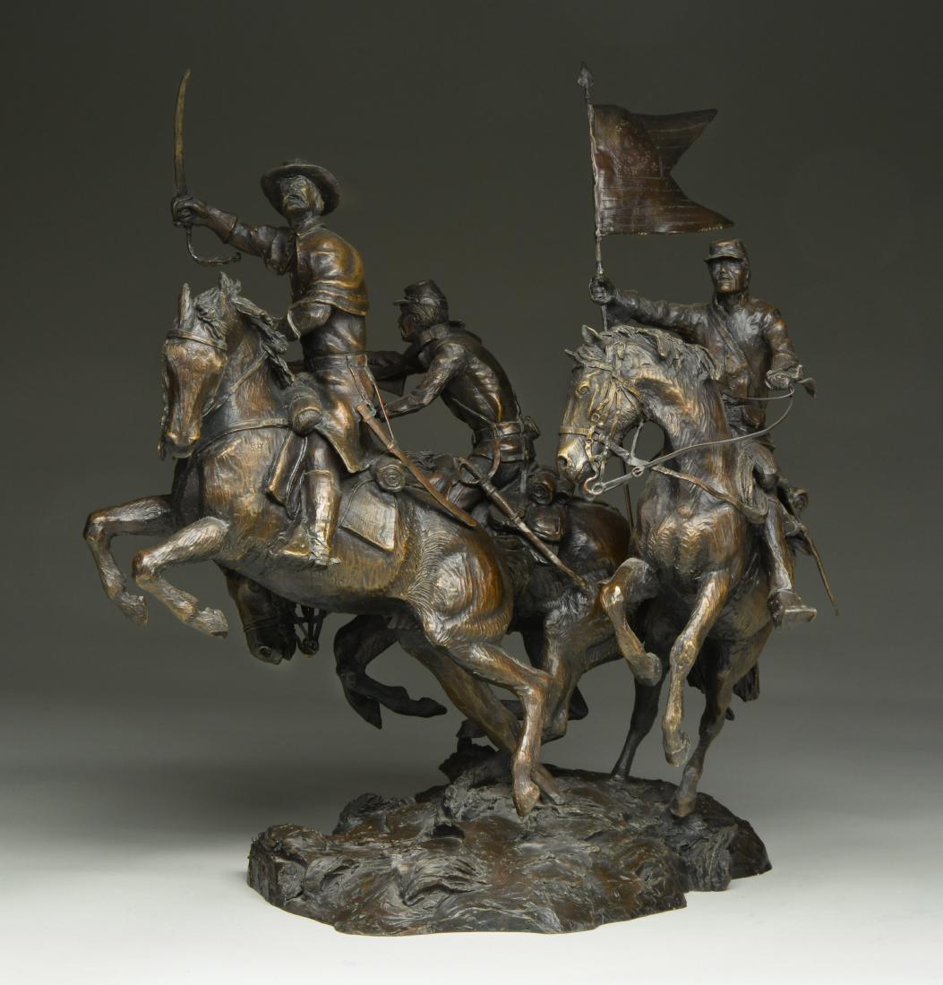 ORIGINAL RUSTY PHELPS CIVIL WAR UNION CAVALRY: BRONZE. This lg. detailed bronze features a charging Union cavalry unit flying a Federal Company C guidon. The officer is leading the charge w/ a Model 1860 cavalry saber wearing a Civil War frock coa