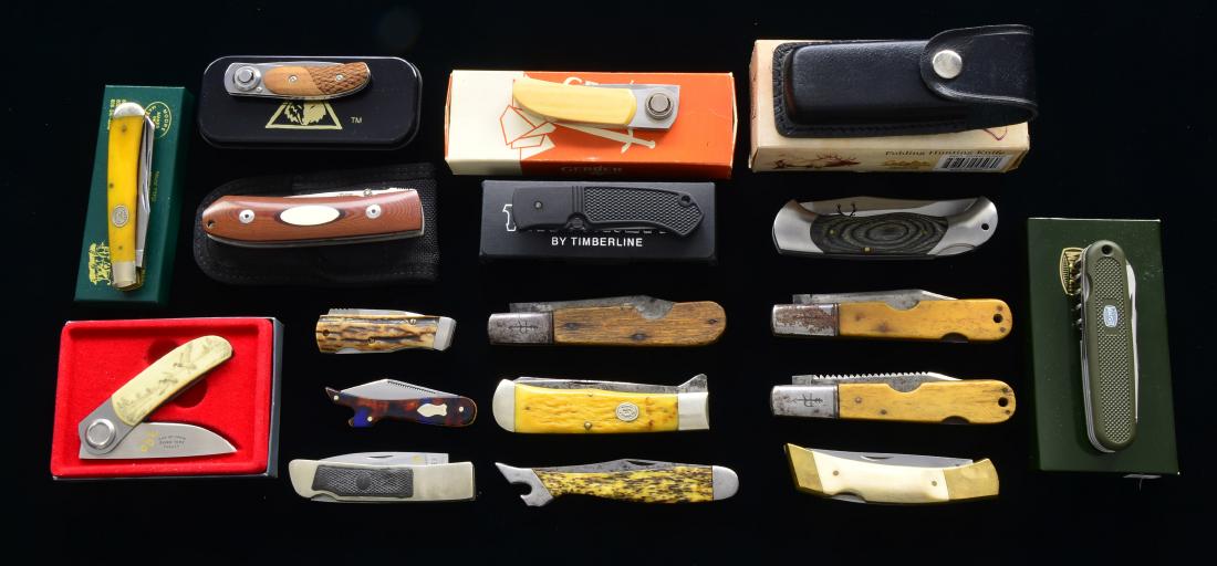 17 FOLDING KNIVES.: 1-3) 3 GERBER PAUL KNIVES: 1 MODEL 2PM. Ivory Micarta scales. NIB. / 1 MODEL 2PS. NIB w/ polymer (?) scales scrimshaw of 2 ducks in flight on 1 side & dog on other. / 1 LONE WOLF KNIVES PAUL KNIFE. Wo