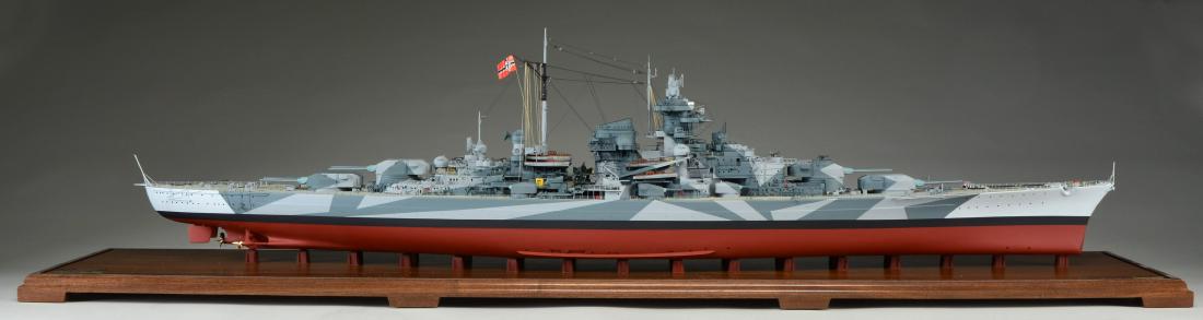 FINE ARTS MODEL OF TIRPITZ.: Model of a Bismarck class battleship of the German Kriegsmarine. Launched in 1939. Sunk by RAF in 1944. Model is in case measuring 57" x 16" x 11". CONDITION: sharp detailed model in near excellent co