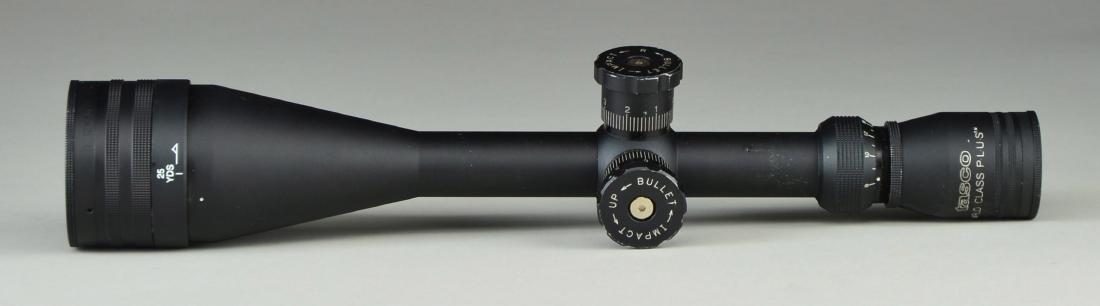 TASCO TARGET SCOPE & CASED WINCHESTER SPOTTING: SCOPE. TASCO WORLD CLASS PLUS TARGET SCOPE. 8-32X50 Matte finished target scope w/ 1" tube, cross hair dot reticle, adjustable objective, lens caps & exposed target knobs. Faint ring marks; all other