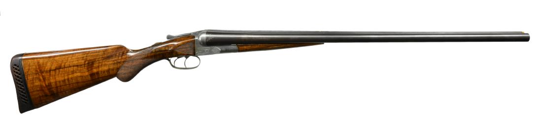 A.H. FOX GRADE B SXS SHOTGUN.: Cal. 12 Ga. S# 10070. Bbls. 28" of Krupp Fluid Steel. White front & mid beads. Boxlock action has borderline engraving w/ scroll highlights having quail on left & woodcock on right side. Dbl. triggers