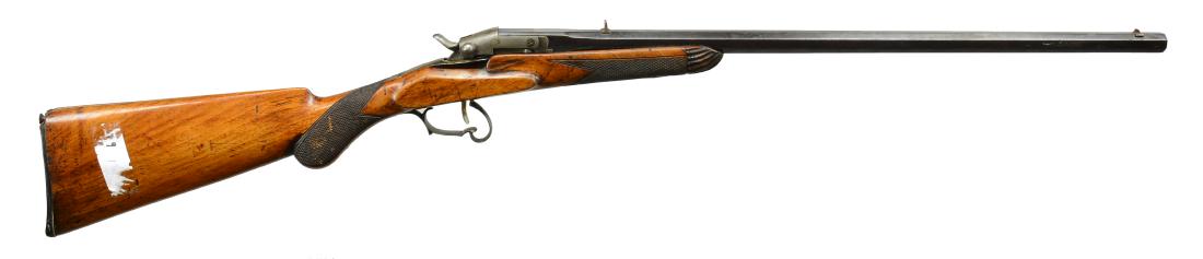 FLOBERT PARLOR RIFLE.: Cal. 22 Rimfire. NSN. Bbl. 23 1/4" oct. Color case hardened breech. Blued bbl. w/ square bbl. breech. Decorative trigger guard. Checkered hardwood pistol grip stock w/ fluted contrasting forend cap. C