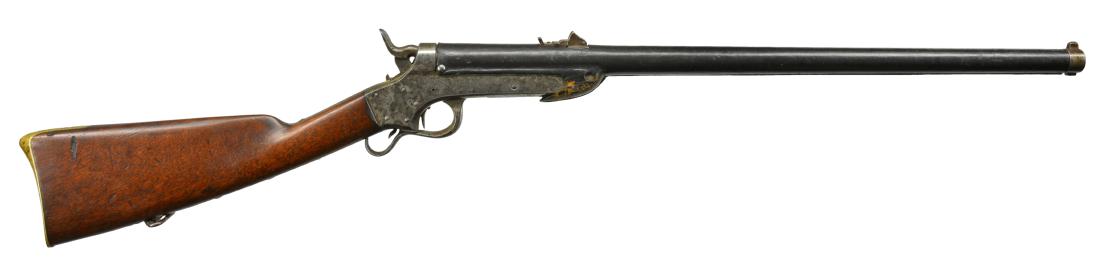 SHARPS & HANKINS MODEL 1862 NAVY CARBINE.: Cal. 52 RF. S# 8499. Bbl. 24" w/ leather covering. Case colored receiver. Straight grained walnut stock w/ brass buttplate & sling swivel. Bbl. has leather covering from muzzle to breech secured by 2 