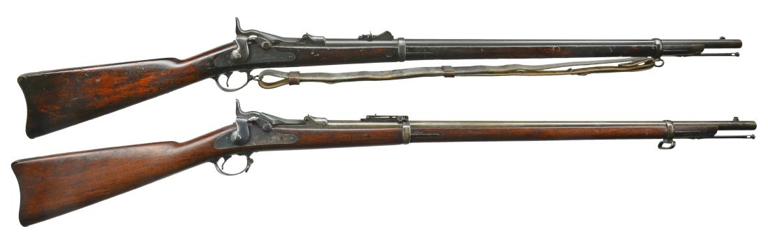 2 SPRINGFIELD TRAPDOOR RIFLES.: 1) MODEL 1873 WITH NEW JERSEY MARKINGS. Cal. 45-70. S# 55736. Bbl. 32 5/8" w/ Model 1879 buckhorn rifle rear sight. High arch breechblock dated 1873. Lock has American eagle followed by "U.S. / Spring