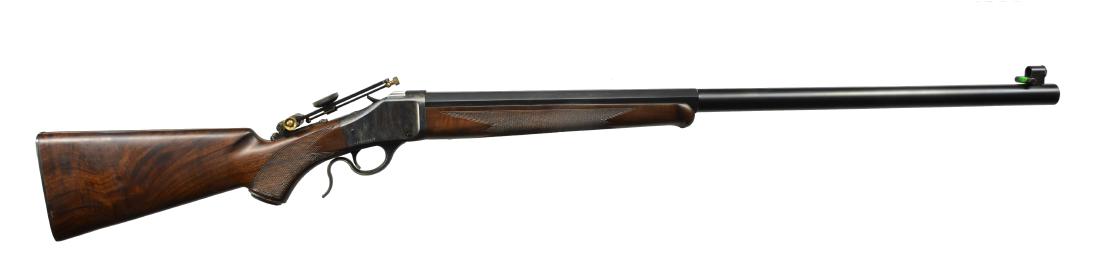 BROWNING MODEL 1885 BPCR FALLING BLOCK RIFLE.: Cal. 45-70. S# 08399NR2B7. Badger 30" half rnd. heavy bbl. w/ globe style, spirit level front sight & tang mounted vernier rear sight. Case colored action. Matte blued bbl. Checkered walnut capped pis