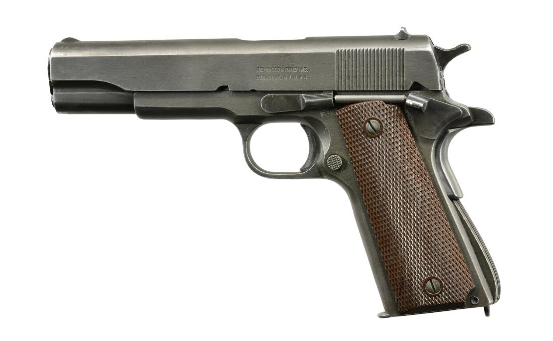 REMINGTON RAND MODEL 1911A1 SEMI AUTO PISTOL.: Cal. 45 ACP. S# No 1605605. Mfg. 1943. Wide serrated ramp front sight. â€œPâ€ marked on slide in front of rear sight. Flat rear sight w/ square notch. Flat side checkered hammer. Long tang grip