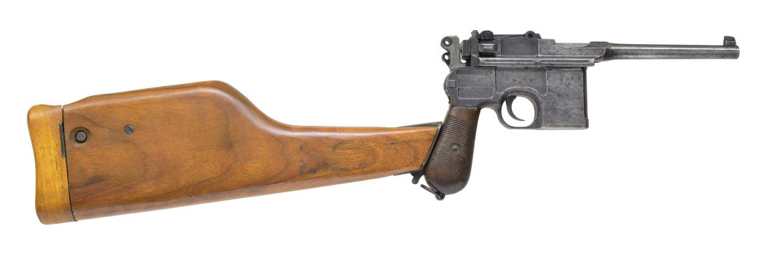 MAUSER C96 PISTOL.: Cal. 7.63. S# 208028. Bbl. 5 1/2". Blade front sight & tangent adj. rear sight. Wooden grips w/ horizontal ribbing, bottom of grip strap equipped w/ lanyard ring. CONDITION: fair. Fading blue blending
