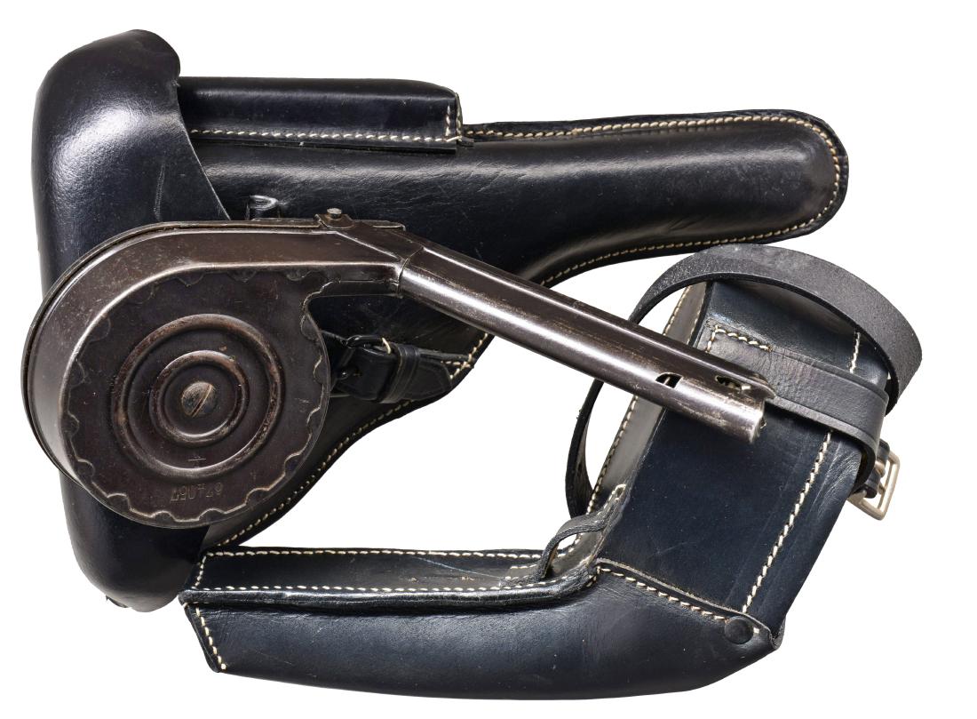 ORIGINAL LUGER SNAIL DRUM MAG. & REPRO. LEATHER.: 1) Original black enameled snail drum numbered 674057 on base & cover. Stamped winder & ribbed case design. CONDITION: light wear marks & occasional spots of peppery oxidation but overall good to very