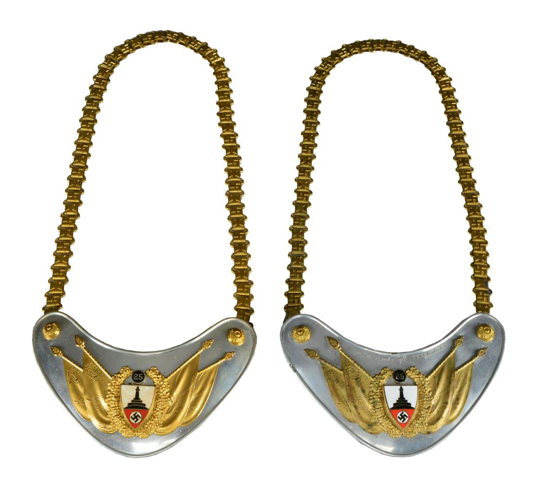 2 WWII GERMAN KYFFHAUSERBUND GORGETS.: 1) Standard half moon gorget w/ aluminum body. Central insignia consists of 4 flags w/ a central wreath in gold surrounding a veteran's organization shield in black, red & white enamel w/ a 25 year bu