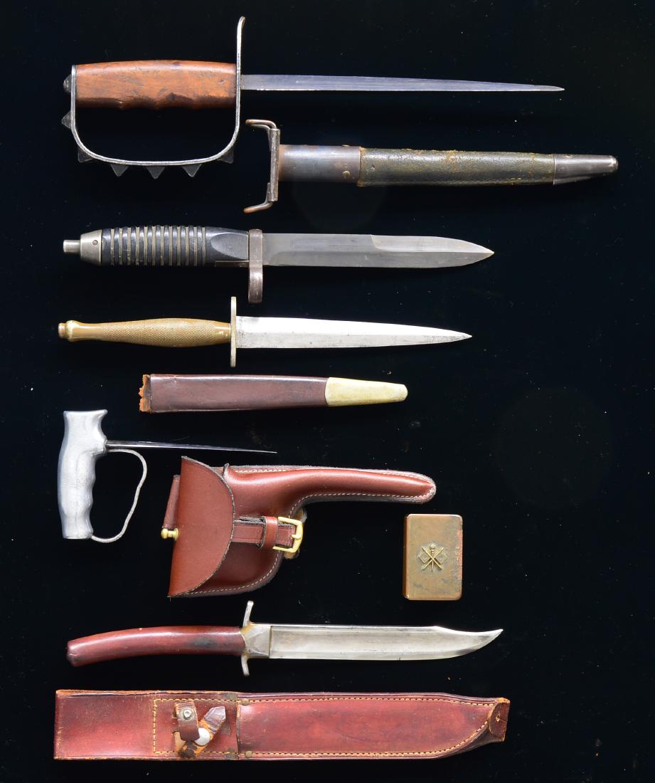 4 COMBAT & COMMANDO KNIVES, 1 BAYONET & MATCH SAFE.: 1) WWII FIGHTING KNIFE. Overall length: 12 1/4". A superbly executed fighting knife which appears to be made from the blade of an early sword. It is similar to the fighting knife pictured on pg. 118 o