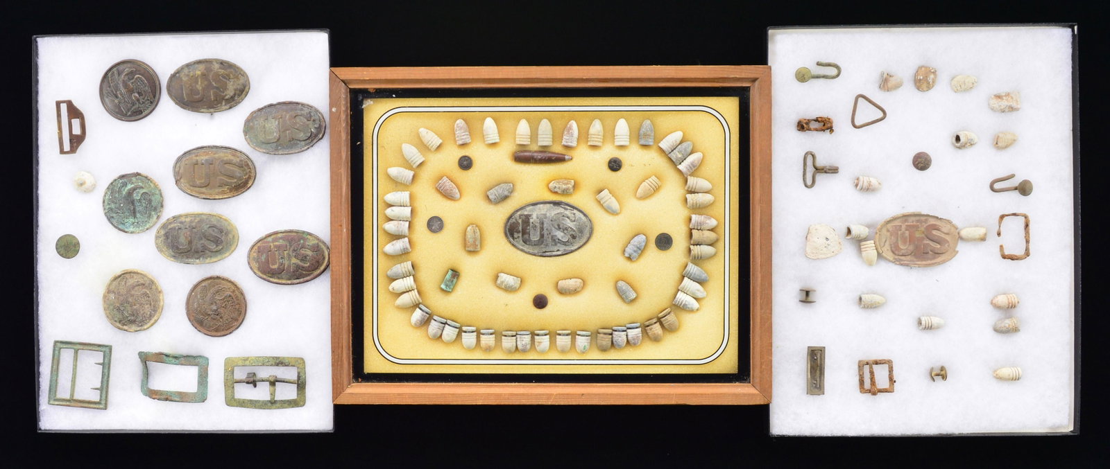 NICE GROUP OF BATTLEFIELD EXCAVATED CIVIL WAR: ACCOUTREMENT PLATES & MISC. ARTIFACTS. This group displayed in 3 large flats consists of a mix of 14 belt buckles, box plates, breast plates, carbine sling buckles & a rare Confederate Georgia frame b