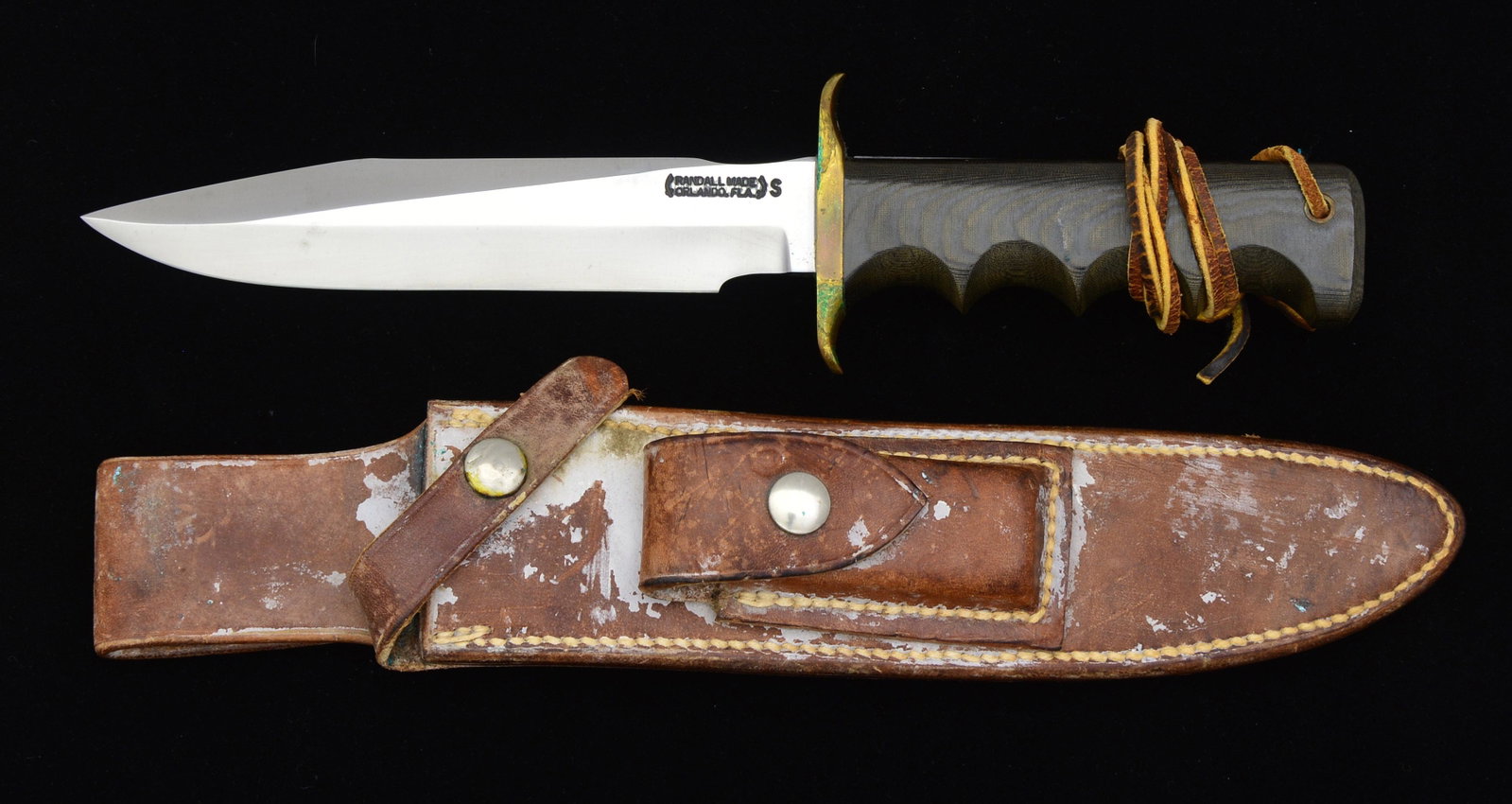 RANDALL FIGHTING KNIFE.: Overall length: 11 1/8". Blade length: 6 5/8". This is a Model 16 SP#1, also known as the "Special #1 Fighter". Clip point blade has a 2 3/4" top edge. Blade stamped, "RANDALL MADE ORLANDO, FLA. S". B