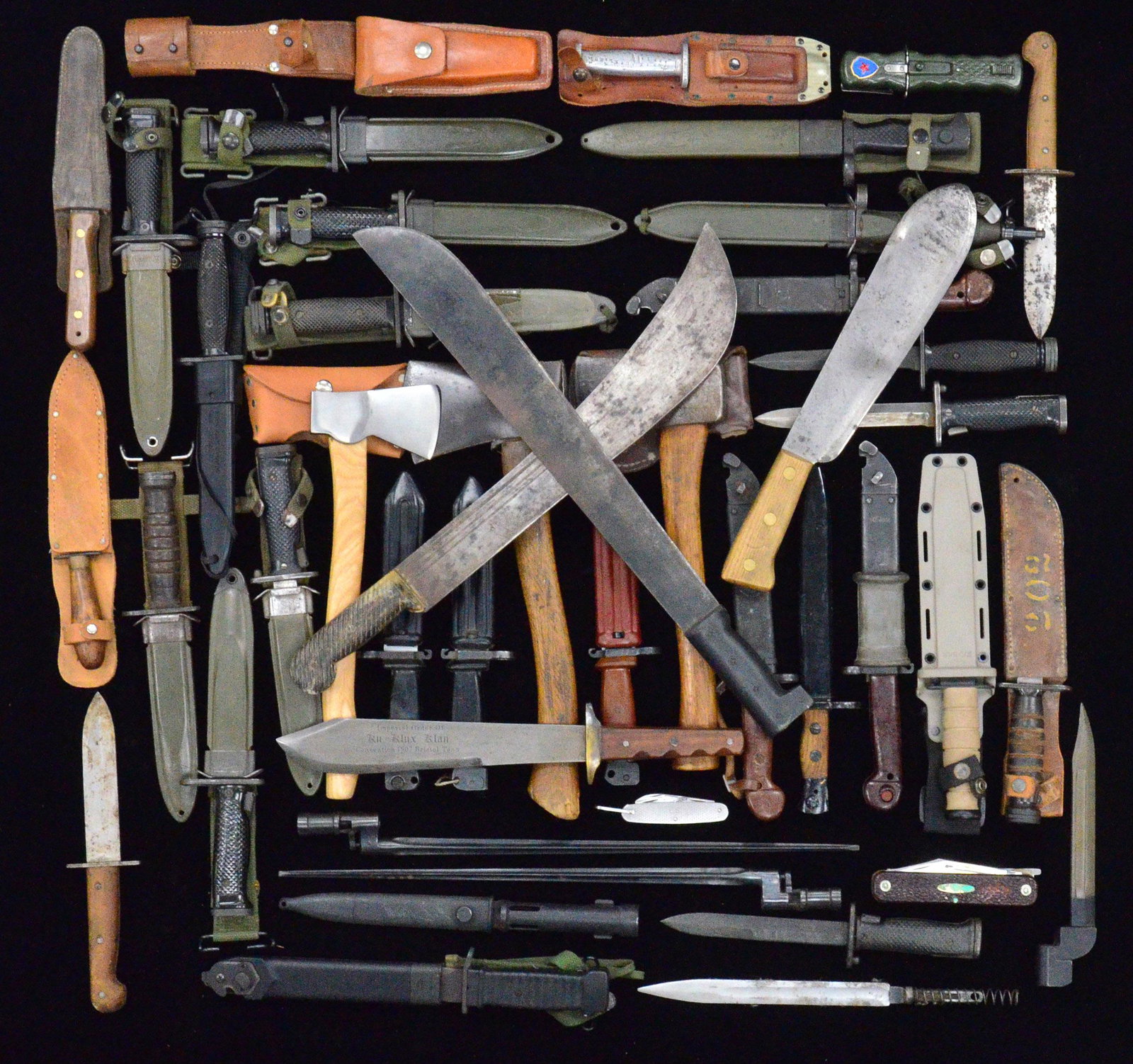 INTERESTING GROUP OF BAYONETS, KNIVES, MACHETES &: HATCHETS. KNIVES: 1 USMC medic's knife marked "USMC / CHATILLON, N.Y.". Bolo blade 11 3/4". Three rivet hardwood handle. / 1 Repro. Bowie knife w/ 10 3/4" blade marked "IMPERIAL ORDER OF / KU KLUX KLA