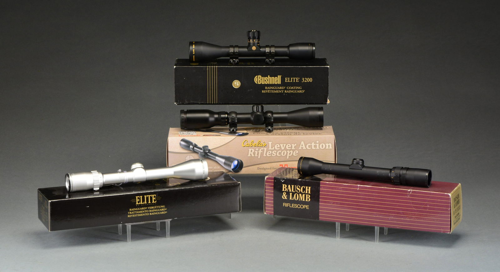 4 RIFLE SCOPES.: Original factory boxes & packaging for each. CONDITION: all aspects of the 4 are near excellent; #3 appears new & unmounted, #4 has light ring marks. 1) CABELA'S LR-3-9X40. Matte black finish w/ cappe