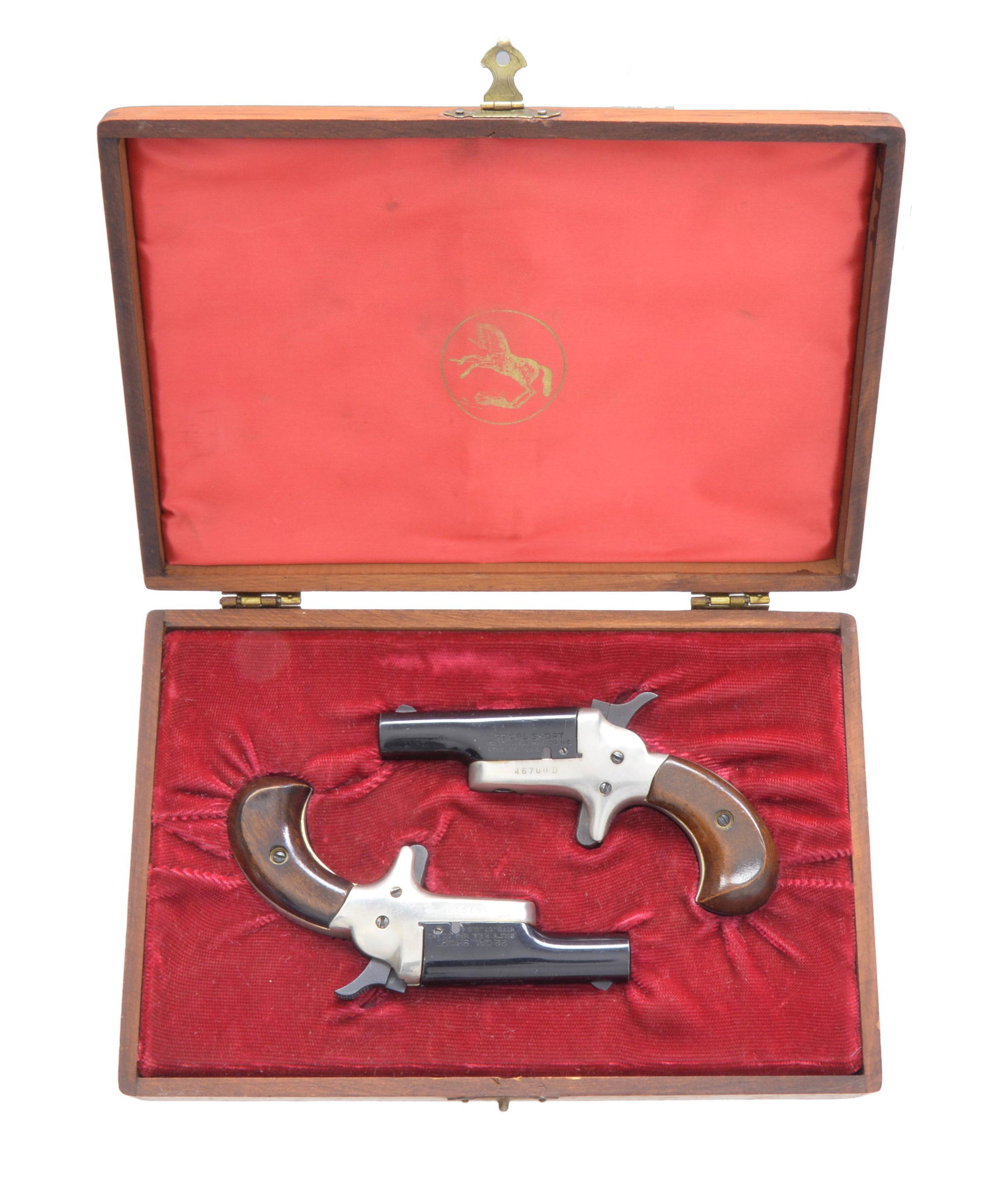 COLT CASED CONSECUTIVE PAIR OF 4th MODEL.: DERRINGERS. BOTH: Cal. 22 Short RF. Bbl. 2 7/16" black chromed w/ blade sights. Mfg. 1960 (1959-1963) w/ nickeled frames & varnished walnut grips. Modern small caliber variation of Thuer 3rd Model. UN