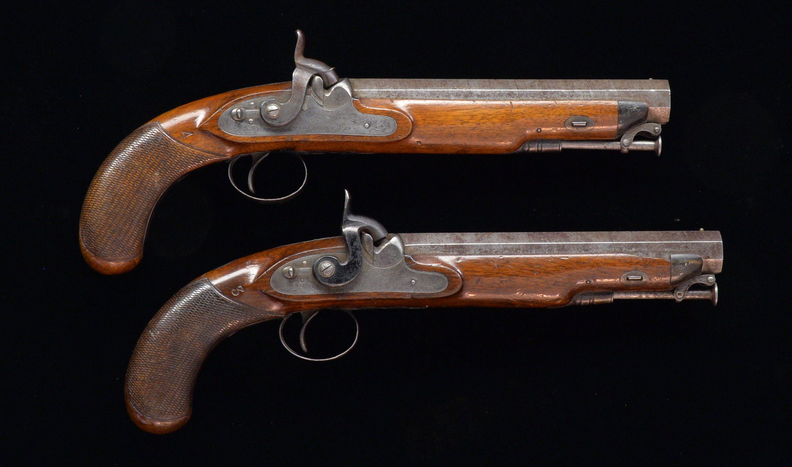 2 PERCUSSION MARTIAL PISTOLS.: FOR BOTH: Cal. 65. S# NSN. 8" damascus oct. bbls. w/ sm. brass bead & notched ears at rear; marked "LONDON" on top flats. Locks w/ safety levers (both inoperable) marked "Hamburger & Co." Wedge retain