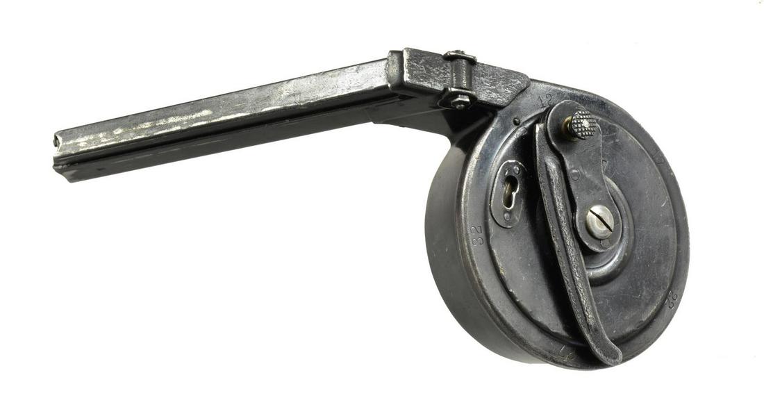 LUGER 32 RD. SNAIL DRUM MAGAZINE.: Type II second issue w/ stamped winder & reinforcing rings on body halves; matching numbered 445457. Originally designed by Friedrich Blum & mfg. by Gebruder Bing of Nuremberg w/ "B/N" marking. Most a