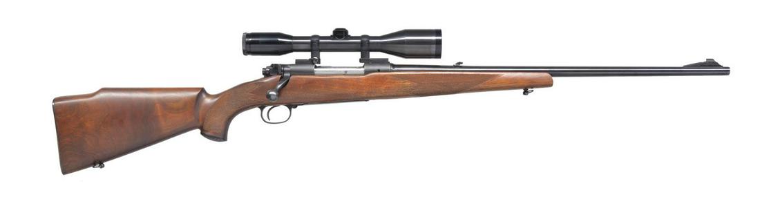 WINCHESTER PRE 64 MODEL 70 FEATHERWEIGHT BOLT: ACTION RIFLE. Cal. 308 Win. S# 280441. Bbl. 22". Ramp mounted bead front sight w/ folding leaf rear sight. Hensoldt & Wetzler Diasta 6x42 gloss finish scope w/ European 3 post reticle on Leupold 2 pie