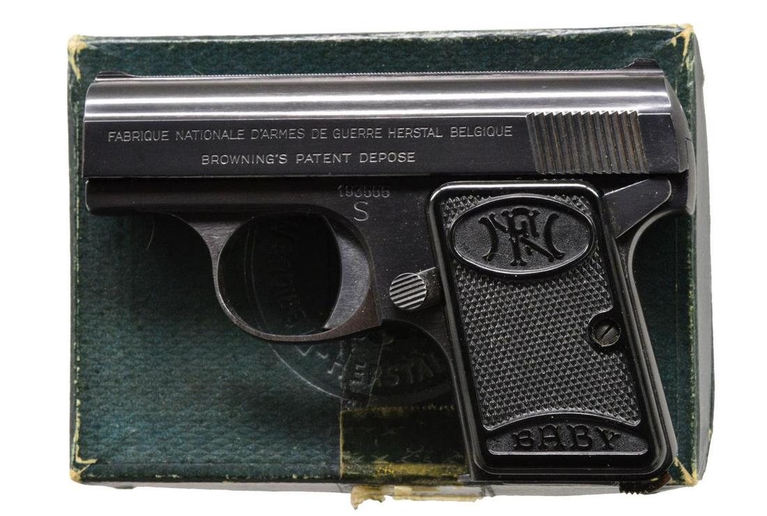 FABRIQUE NATIONAL BABY SEMI AUTO PISTOL.: Cal. 6.35mm (25 ACP). S# 193555. Bbl. 2". Left side of slide marked "FABRIQUE NATIONAL D'ARMES DE GURRE HERSTAL BELGIQUE / BROWNING'S PATENT DEPOSE". Blue finish. 2 Piece checkered plastic grip marked