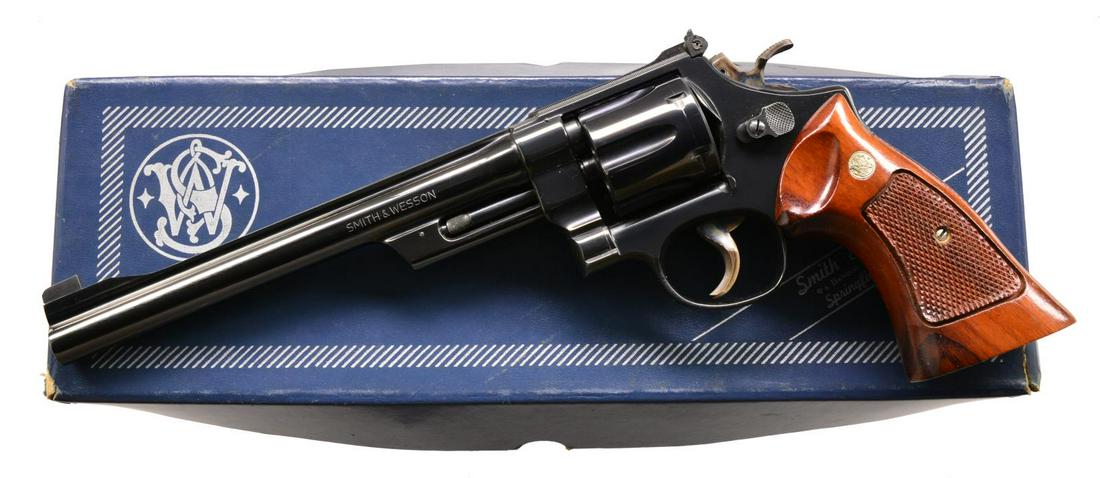 SMITH & WESSON 27-2 DA REVOLVER.: Cal. 357 Mag. S# N166574. Bbl. 8 3/8" w/ rib. Patridge front sight w/ square notched adj. rear sight. 6 Shot fluted cyl. 3 Screwed action w/ pinned bbl. Cased colored target hammer & serrated target t