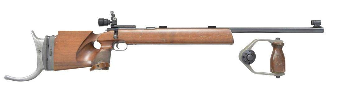 ANSCHUTZ MODEL 54 MATCH BOLT ACTION RIFLE.: Cal. 22 LR. S# 67282. Bbl. 27" heavy target weight. Anschutz Match rear sight & globe front sight. Bbl. fitted w/ target blocks. Single shot action w/ adj. target trigger. Thumb hole target stock w/ a