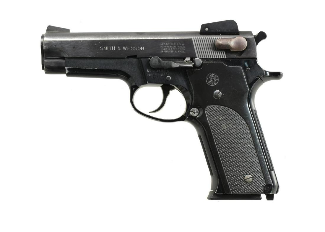 SMITH & WESSON MODEL 459 SEMI-AUTO PISTOL.: Cal. 9mm Luger. S# A734651. Bbl. 4". Mfg. 1981 (1979-1987) w/ blued finish, alloy frame, adj. rear sight, lanyard loop at butt, recoil spring guide rod & checkered plastic grips. Slide & mag. safeties