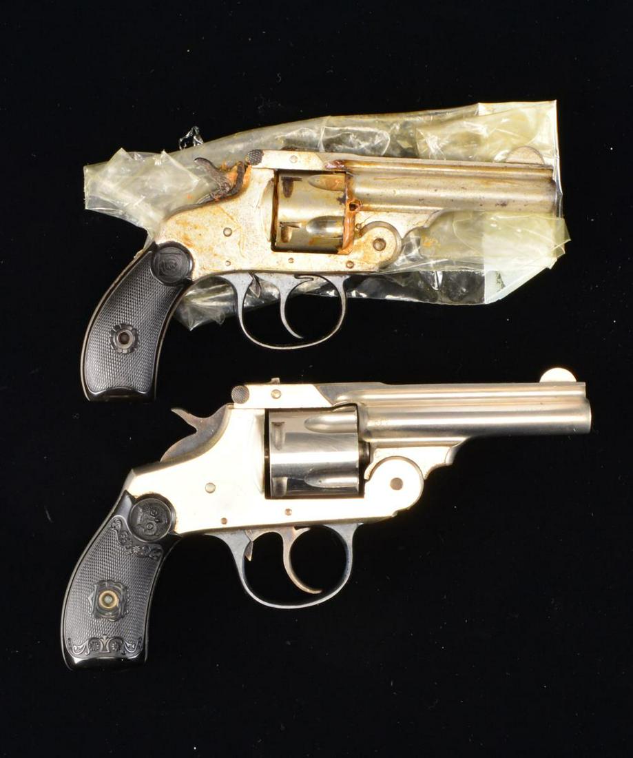2 VINTAGE NICKEL PLATED TOP BREAK REVOLVERS.: 1) HARRINGTON & RICHARDSON AUTO EJECTING THIRD MODEL. Cal. 32 S&W. S# 316014. Bbl. 3" w/ half moon blade & no patent date; cal. on left side. Mfg. 1913-1915 w/ blued trigger guard & checkered target l