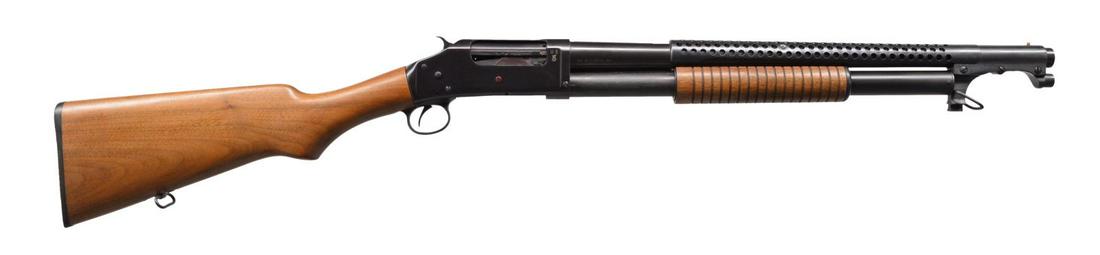 NORINCO MODEL 97TW PUMP TRENCH SHOTGUN.: Cal. 12 Ga., 2 3/4". S# MIL2532. Bbl. 20 3/8" w/ fixed cyl. bore. 6 Row sheet metal handguard attached to bayonet lug. Blue finished exposed hammer action. Right side of receiver is marked "US" over f