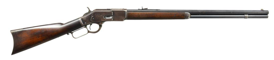 WINCHESTER 1873 LEVER ACTION RIFLE.: Cal. 38 WCF. S# 564297B. Bbl. 24" oct. Sporting front sight & elevator adj. buckhorn sporting rear sight. Full length mag. Blue finished 3rd Model action. Walnut forearm & straight grip stock w/ trapd