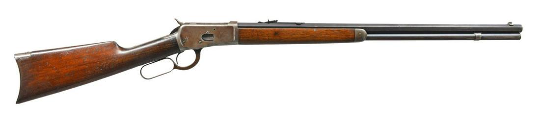 WINCHESTER 1892 LEVER ACTION RIFLE.: Cal. 38 WCF. S# 884960. Bbl. 24" oct. w/ bead front sight & flat top sporting rear sight. Full length mag. Blue finish. Walnut forearm & straight grip stock w/ crescent steel buttplate. Mfg. 1919. CON