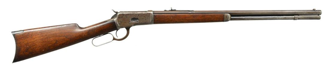 WINCHESTER 1892 LEVER ACTION RIFLE.: Cal. 38 WCF. S# 265424. Bbl. 24" oct. Blade front sight w/ sporting rear sight having replacement elevator. Full length mag. tube. Walnut forearm & straight grip stock w/ crescent steel buttplate. 190