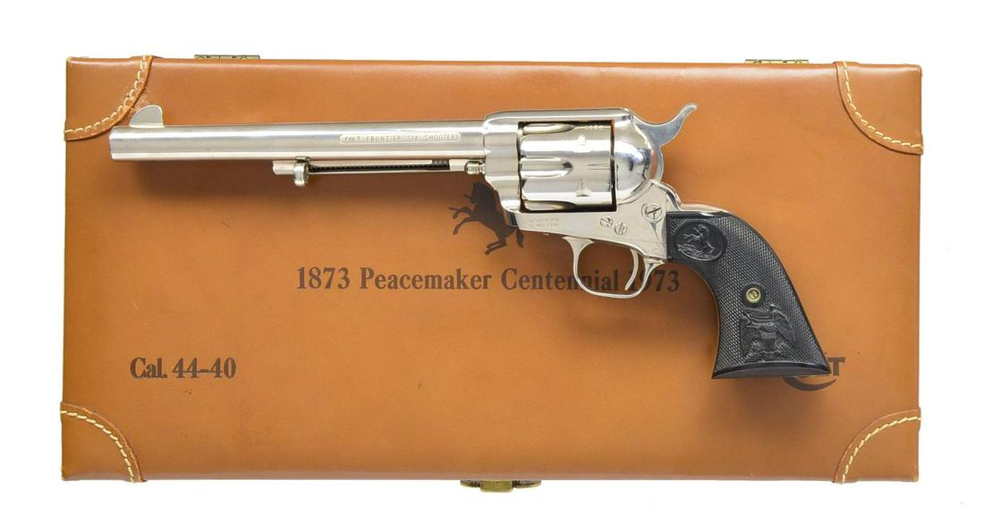 COLT 1873 PEACEMAKER CENTENNIAL FRONTIER SIX: SHOOTER SAA REVOLVER. Cal. 44-40. S# 1023PC. Bbl. 7 1/2" w/ etched panel style "COLT FRONTIER SIX SHOOTER" caliber marking. Blade front sight. Six shot fluted cyl. Full nickel finish. 2 Piece checkere