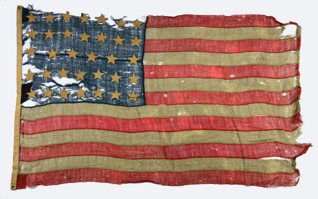MISC. GROUPING INCLUDING CIVIL WAR FLAG, BADGE &: PHOTO. This grouping consists of a 34 star American flag that has ink inscription on hoist "Cap Andrews / Goshen". All hand sewn measuring approx. 60" on hoist by 84" on fly. Accompanying flag is a Co