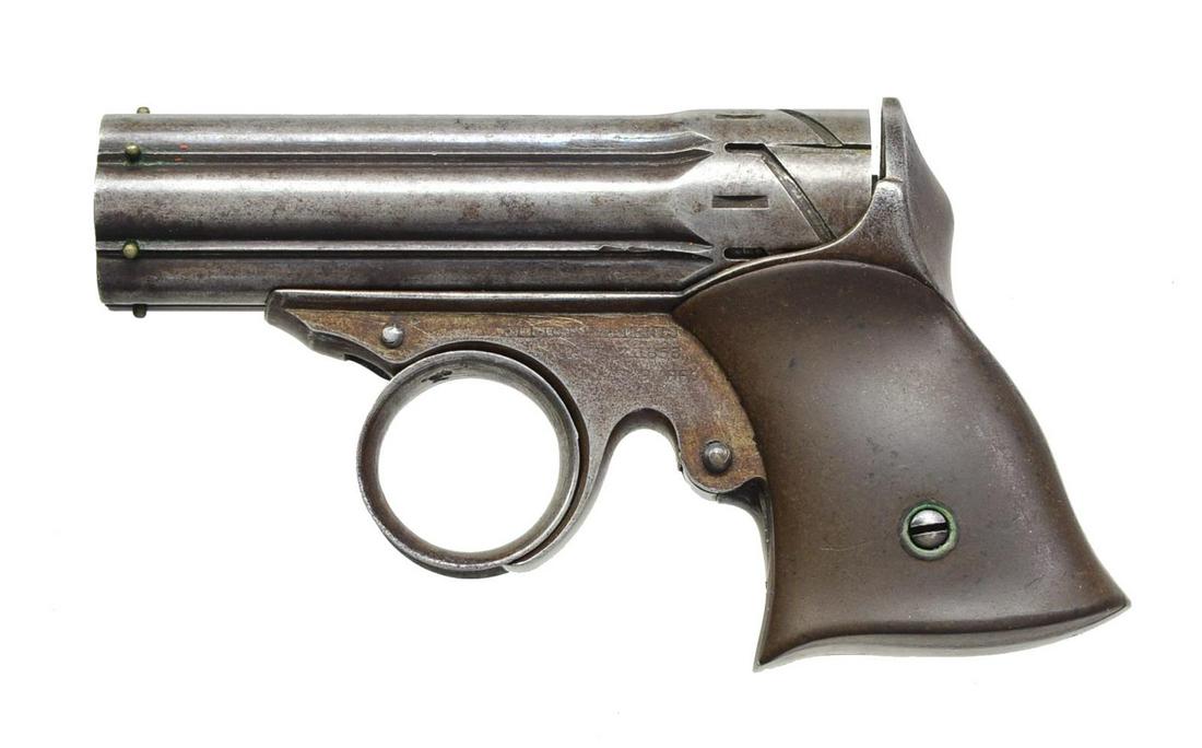 REMINGTON ZIG ZAG DERRINGER.: Cal. 22 Short. NSN. Bbl. 3 3/16" Six shot cluster w/ zig-zag grooves at breech. Brass front beads. Ring type trigger. DA w/ concealed hammer. Loading is done through port at breech of frame. 2 Piece h