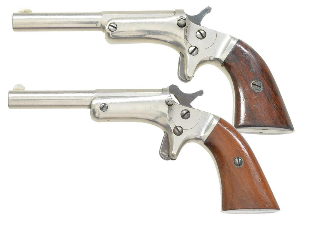 2 STEVENS OLD MODEL POCKET PISTOLS.: BOTH: bbls. 3 1/2" oct. to rnd. w/ semi circular front sight. Spur trigger actions w/ straight style release buttons, spring type extractors, side plates & full nickel finish. 2 Piece rosewood grips. 