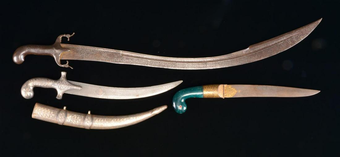 3 INDO-PERSIAN EDGED WEAPONS.: 1) INDO-PERSIAN DAGGER. Overall length: 18”. Blade length: 12”. A beautiful silver inlaid dagger likely originating in northern India in a style similar to a Khanjar. Curved blade has a beautiful