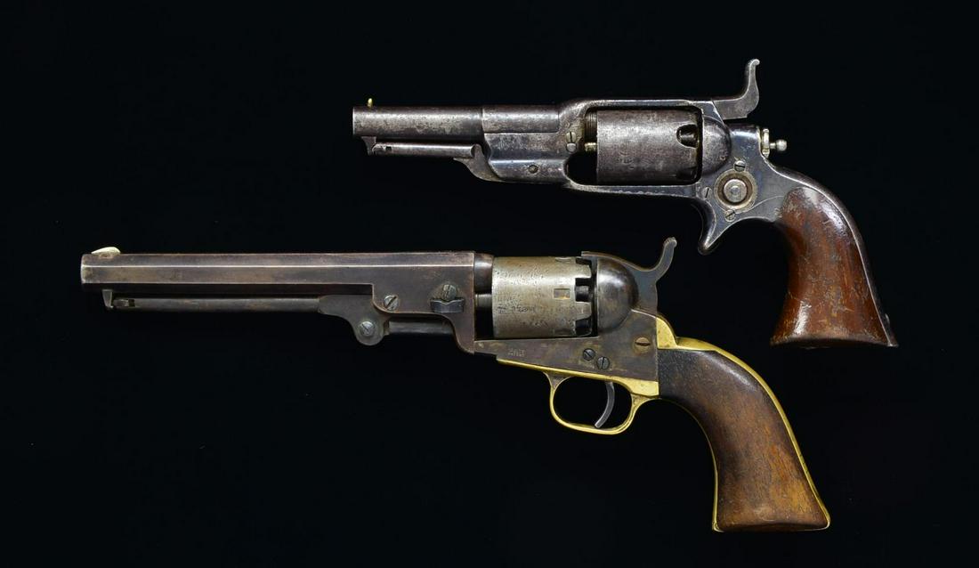 COLT ROOT & 1849 POCKET REVOVLERS.: BOTH: cal. 31. 1) ROOT MODEL 6. S# 9030. Bbl. 3 1/2" w/ brass bead front sight. 5 Shot rnd. cyl. w/ stagecoach hold up roll engraving. Blue finished action w/ side mounted hammer & spur trigger. 1 Pie