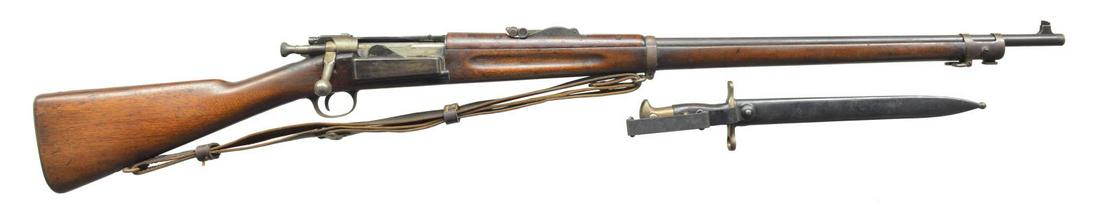 US MODEL 1898 KRAG BOLT ACTION RIFLE.: Cal. 30-40 Krag. S# 472410. Bbl. 30". Rifle fitted w/ Model 1902 tangent rear sight w/ sliding peep. Blade front sight. Walnut stock & handguard. Stock has legible, boxed “JSA 18 1903” & faint enc