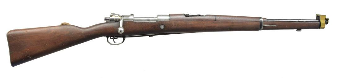 ARGENTINE MODEL 1909/47 CAVALRY CARBINE.: Cal. 7.65 Argentine. S# 013195. Bbl. 22 3/8". All visible numbers match including brass front sight cover. Import mark on left side of bbl. Receiver marked on left rail "DIRECCION GENERAL BE FABRICACI