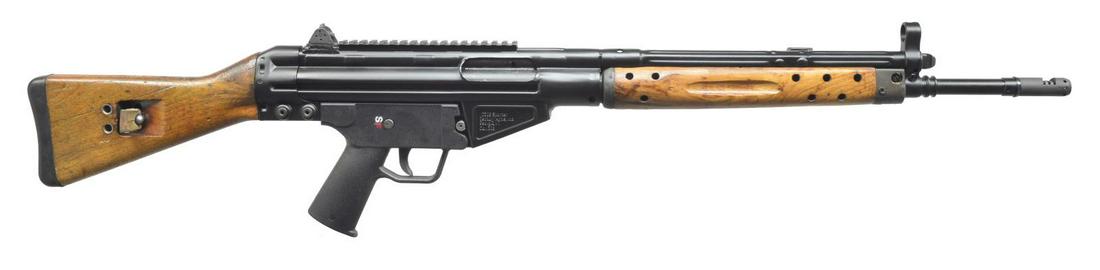 CENTURY ARMS C308 SPORTER SEMI-AUTO RIFLE.: Cal. 308 Win. S# C308E30311. Bbl. 18 1/2" plus 12 port muzzle brake. Mfg. 2002-2011 w/ synthetic HK style stock set. HK style shielded front sight; fixed rear w/ 3 apertures & 1 V notch. Matte black f