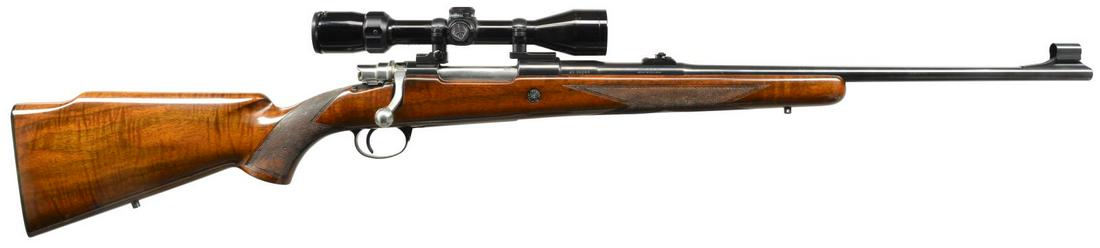 BROWNING SAFARI BOLT ACTION RIFLE.: Cal. 30-06. S# 4L25549. Bbl. 22" w/ hooded ramp bead front sight & folding leaf rear sight. FN Supreme long extractor action w/ side safety. Alloy floorplate & trigger guard w/ gold filled engraving.