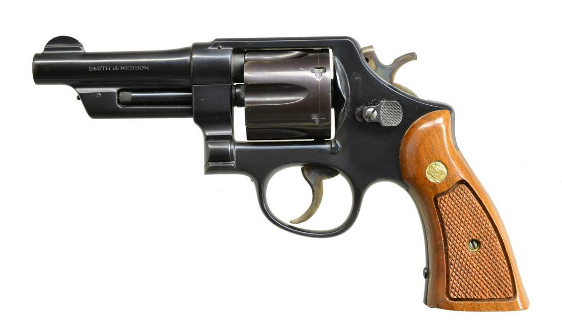 SMITH & WESSON 38/44 HEAVY DUTY POST WAR DA: REVOLVER. Cal. 38 Spl. S# S106090. Bbl. 4" rnd. w/ semicircular front sight & fully shrouded ejector. 6 Shot fluted cyl. Pinned bbl., 5 screw N frame action w/ case colored hammer & trigger. 2 Piece c