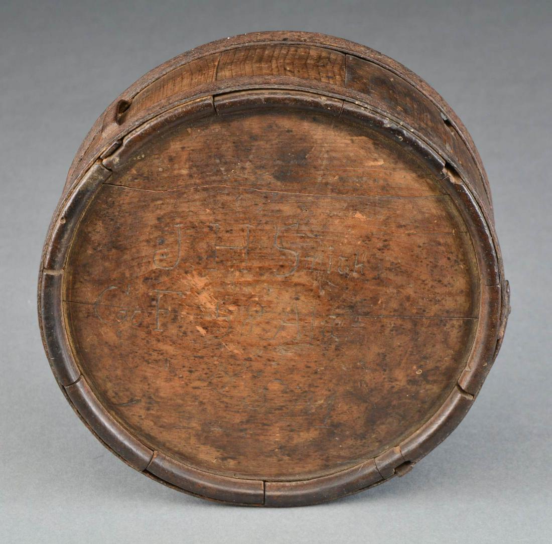 CONFEDERATE CANTEEN CARRIED BY JAMES SMITH, CO. F: 58TH ALA. Impeccably carved “J H SMITH / Co F 58 Ala.”. Canteens both North & South are often identified by soldiers scratching or carving names or initials; it’s always scarce though to find fu