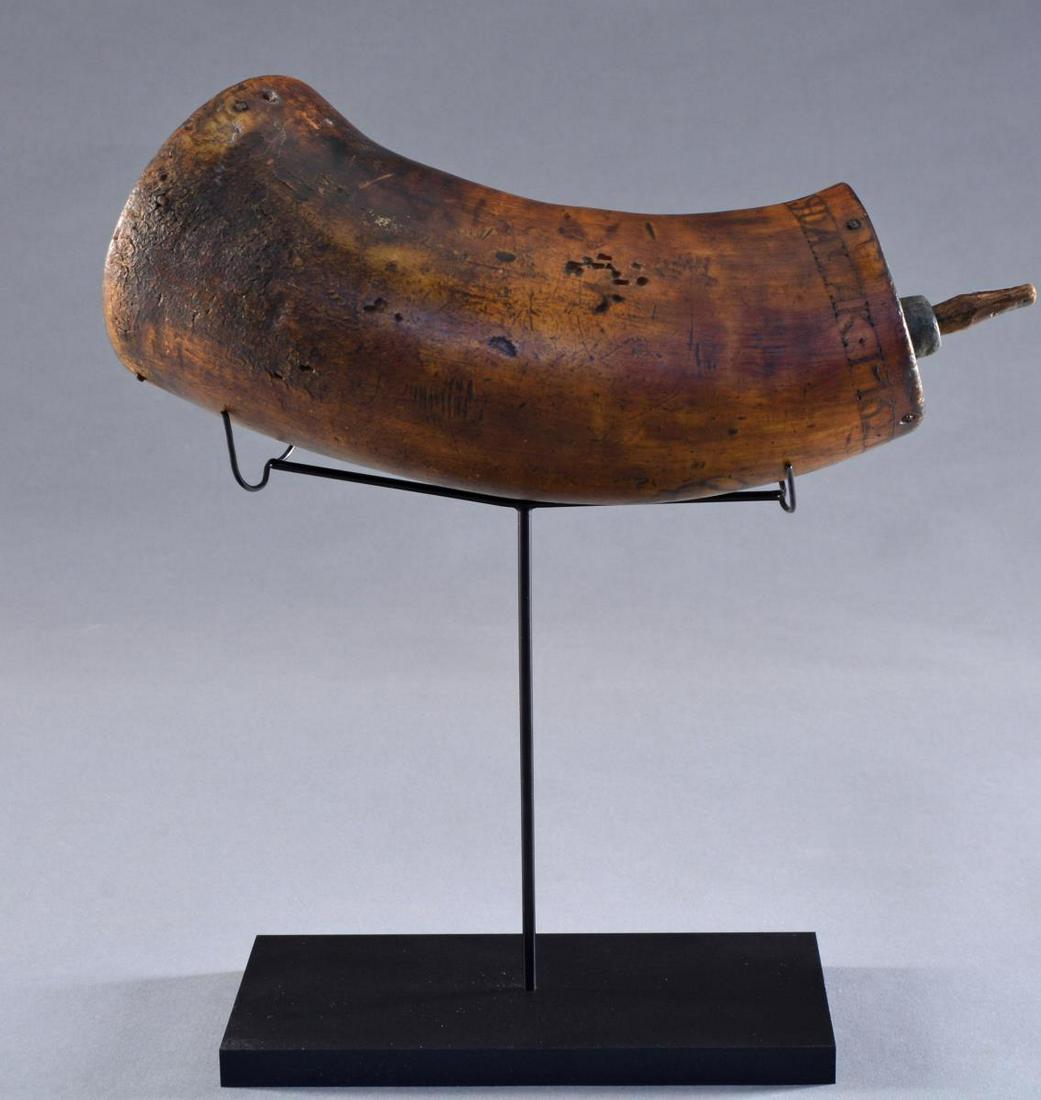 RARE “THOMAS JOHNSON” BOTTLE HORN “ONYDALAK 1762”.: This most unusually large 7" rum horn w/ pewter spout looks like it would hold a pint, 3 1/2" base. Scrimshawed on one side is a lg. British coat of arms & circling above it: “THOs JOHNSON ONYDALAK