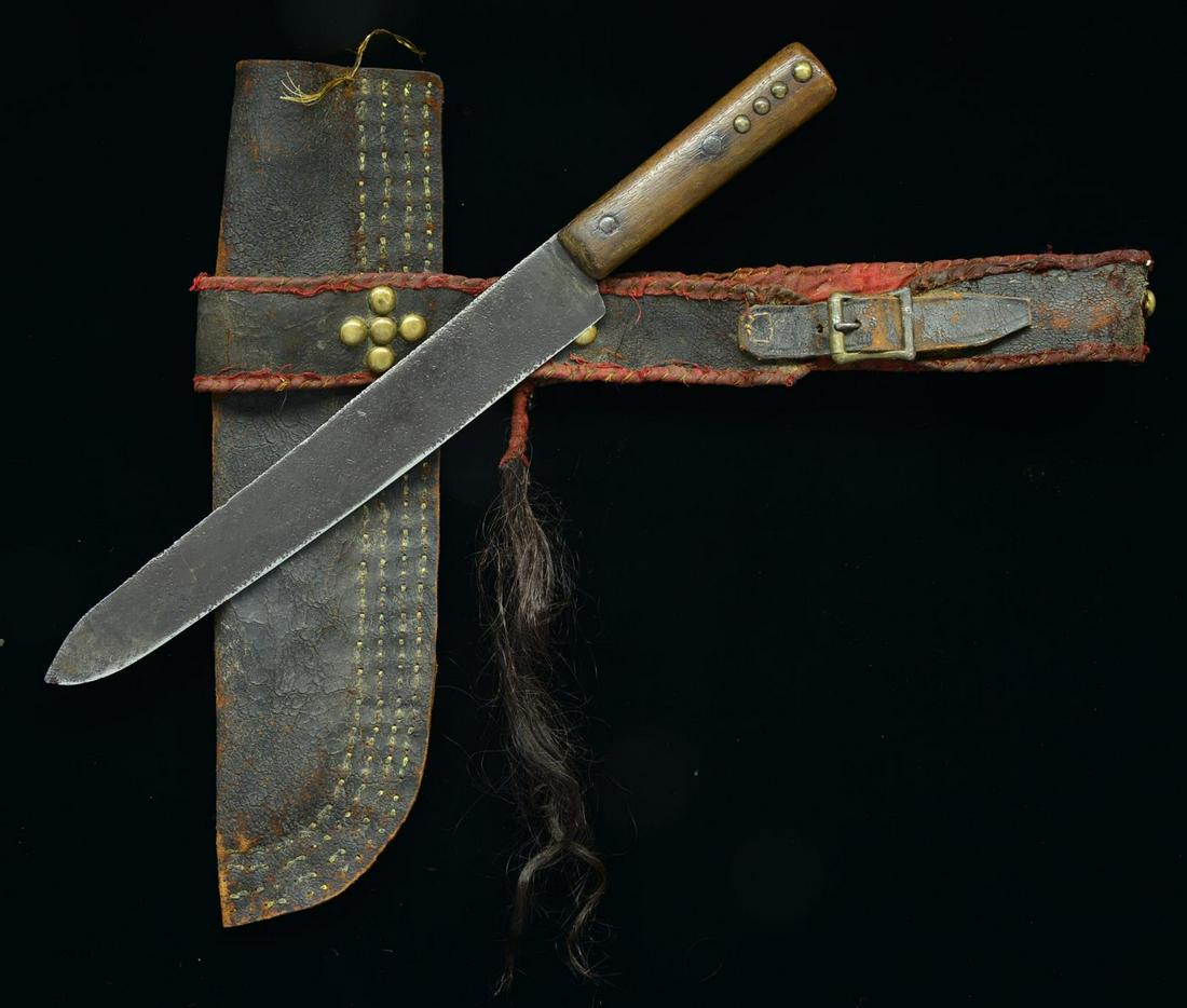 NATIVE AMERICAN STYLE BELT KNIFE & SHEATH.: Overall length of knife: 17 1/4". Blade length: 11 3/4". Plain blade forged from an iron file. 1 Piece wood grip w/ 2 iron rivets on either side & 4 brass tacks on either side. Leather belt lined w/ r
